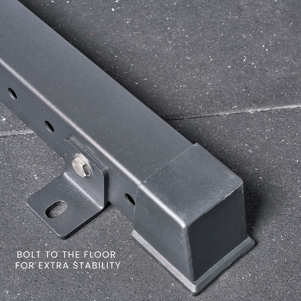Close-up of a squat rack's floor support bracket, showcasing bolt feature for enhanced stability in home gym equipment Australia.