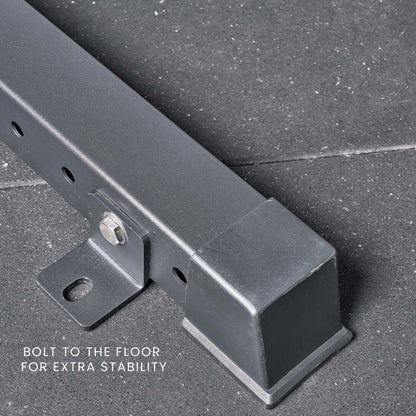 Close-up of a squat rack's floor support bracket, showcasing bolt feature for enhanced stability in home gym equipment Australia.